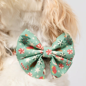 Dog wearing a festive bow tie with a white background