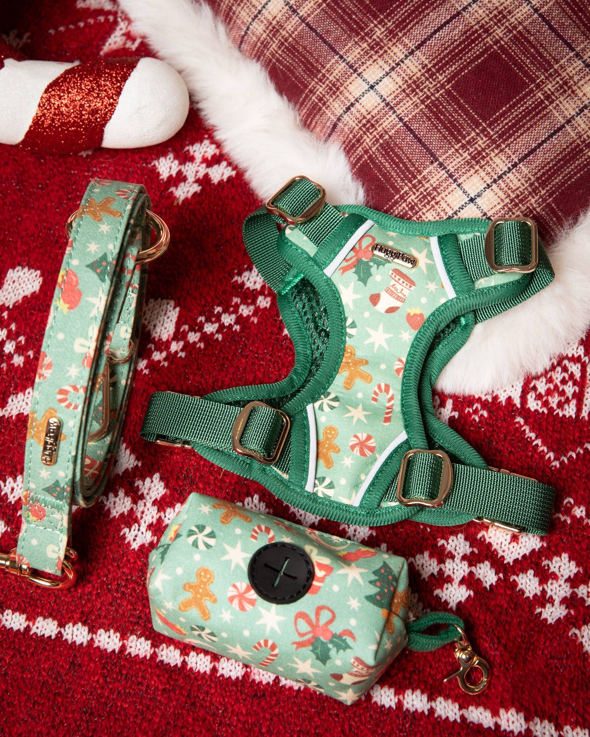 Dog harness, leash, and bag set with Christmas pattern on a red and white checkered fabric background